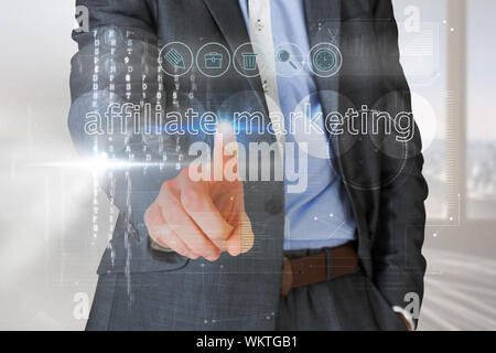Businessman touching the words affliate marketing on interface against abstract white line design in room Stock Photo