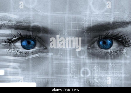 Composite image of blue eyes on grey face against interface Stock Photo