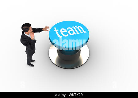 The word team and thoughtful asian businessman pointing against white background Stock Photo