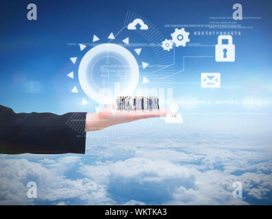 Business people standing up against blue sky over clouds at high altitude Stock Photo