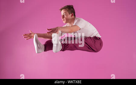 Cool break dancer mid air in the dance studio Stock Photo