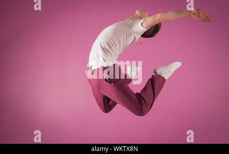 Cool break dancer mid air in the dance studio Stock Photo