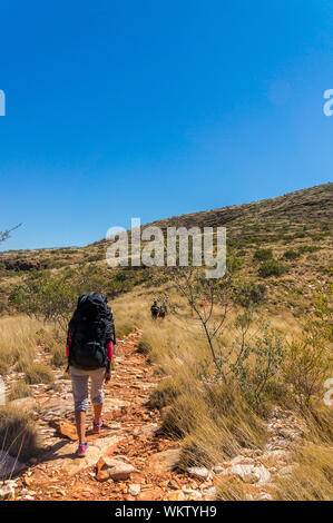 Hiker at the top of Mount Gillen just outside Alice Springs in central Australia. Stock Photo