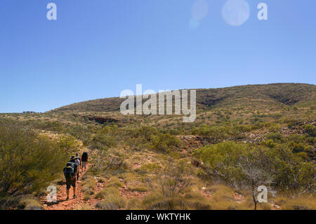 Hiker at the top of Mount Gillen just outside Alice Springs in central Australia. Stock Photo