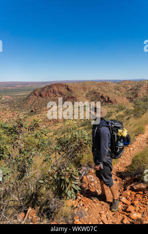 Hiker at the top of Mount Gillen just outside Alice Springs in central Australia. Stock Photo