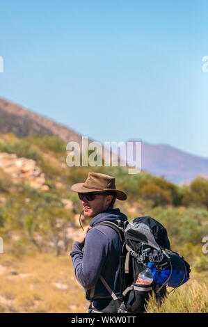 Hiker at the top of Mount Gillen just outside Alice Springs in central Australia. Stock Photo