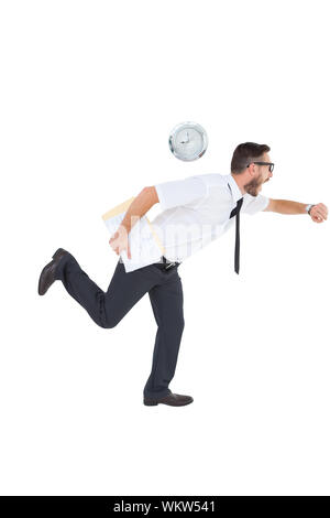Geeky young businessman running late on white background Stock Photo