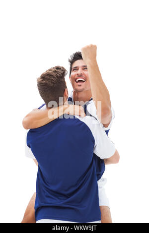 Football players celebrating a win on white background Stock Photo