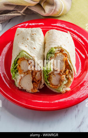 Crispy chicken Caesar salad wrap sandwich with romaine lettuce Stock Photo