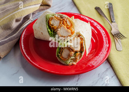 Crispy chicken Caesar salad wrap sandwich with romaine lettuce Stock Photo