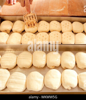 Professional Bakery - Finishing Touches on Pastry before Baking