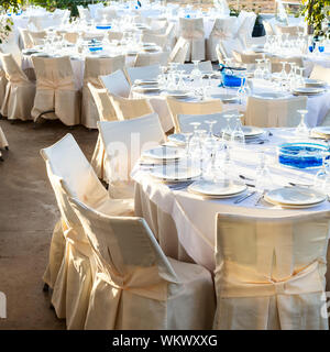 Table setting for an event party at outdoor cafe in the evening light Stock Photo