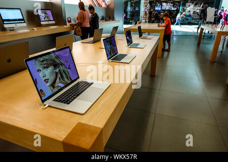 Orlando,FL/USA-8/27/19: A row of MacBook Pros on display at a retail store. Stock Photo