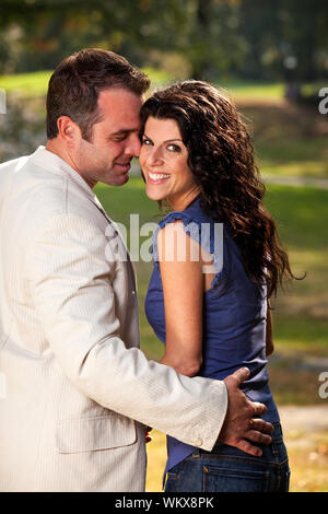 A happy couple in the park having fun on a warm day Stock Photo