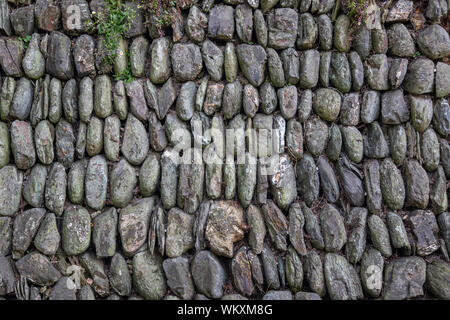 Historic dry stone wall built in traditional Cornish style in England Stock Photo