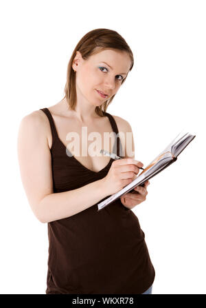 Young woman going write in day planner isolated on white Stock Photo