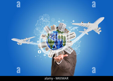 Businessman holding earth with buildings. Element of this image furnished by NASA Stock Photo
