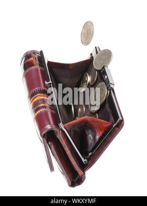 Coins falling into a female purse isolated over white background Stock Photo