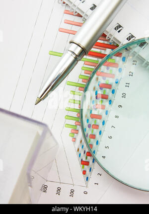 Graphs tables and documents laid on the table Stock Photo