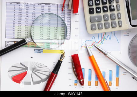 Graphs tables and documents laid on the table Stock Photo