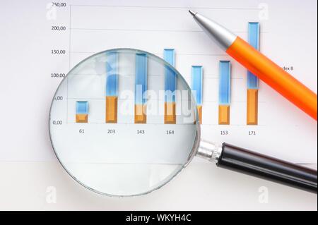 Graphs tables and documents laid on the table Stock Photo