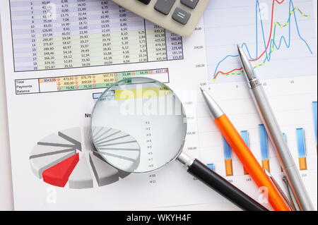 Graphs tables and documents laid on the table Stock Photo
