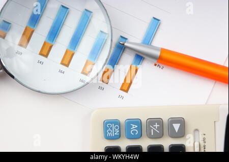 Graphs tables and documents laid on the table Stock Photo