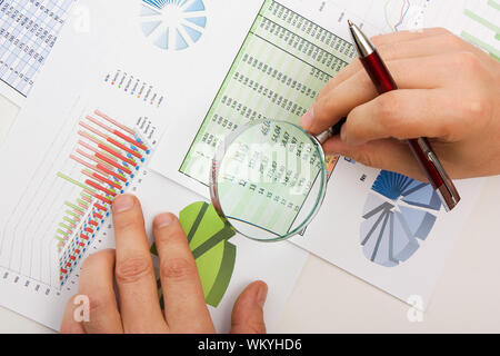 Graphs tables and documents laid on the table Stock Photo