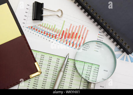 Graphs tables and documents laid on the table Stock Photo