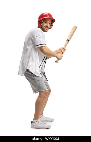 Full length shot of a man playing baseball and holding a bat isolated on white background Stock Photo