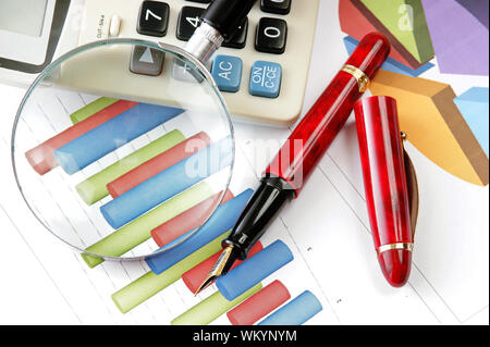 Graphs tables and documents laid on the table Stock Photo