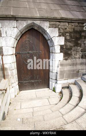 ancient decorate door outside christ church cathedral at dublin Stock Photo