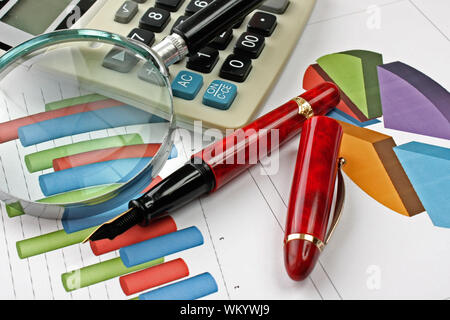 Graphs tables and documents laid on the table Stock Photo