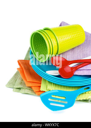 Stack of Multi Colored Cloth Napkins with Plastic Plates, Spoons and Cups isolated on White background Stock Photo