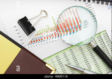 Graphs tables and documents laid on the table Stock Photo