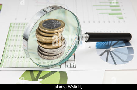 Graphs tables and documents laid on the table Stock Photo