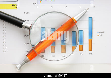 Graphs tables and documents laid on the table Stock Photo