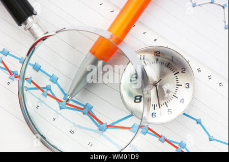 Graphs tables and documents laid on the table Stock Photo