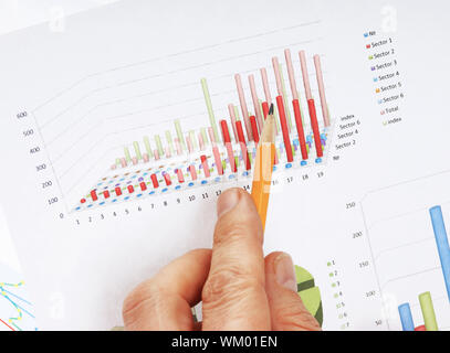 Graphs tables and documents laid on the table Stock Photo