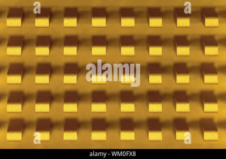 Macro-photo of a small golden metal radiator Stock Photo
