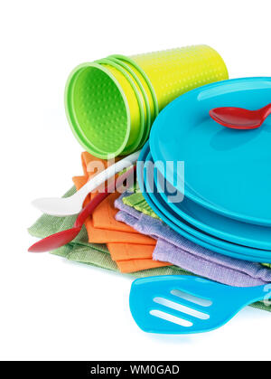 Arrangement of Multi Colored Cloth Napkins with Plastic Plates, Spoons and Cups isolated on White background Stock Photo