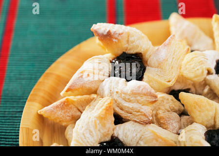 Finnish star-shaped joulutorttu christmas puff pastrieswith dried plum marmalade Stock Photo