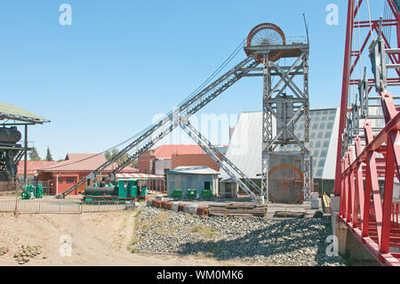 Headframe (also known as a gallows frame, winding tower, hoist frame, pit frame, shafthead frame, headgear, headstock or poppethead) at the historical Stock Photo