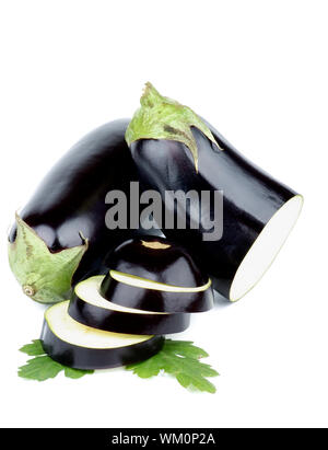 Ripe Raw Eggplants Full Body and Slices with Leafs isolated on white background Stock Photo
