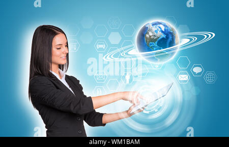 Beautiful businesswomen in suit using digital tablet. Earth and hexagons with icons. Element of this image furnished by NASA Stock Photo
