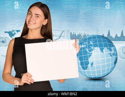 Businesswoman hold paper sheet. Earth and graphs as backdrop. Elements of this image furnished by NASA Stock Photo