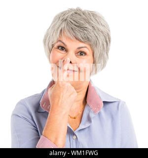 Portrait of a elderly woman making a funny face Stock Photo