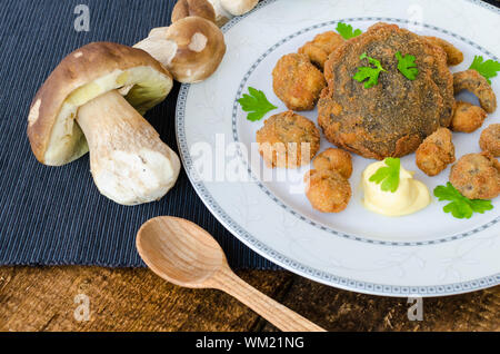 Fried mushrooms with home made bread, mushrooms from czech woods Stock Photo