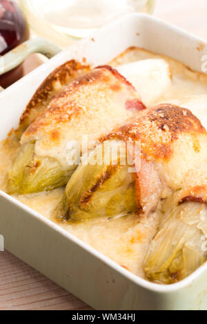 chicory baked with bacon and cheese Stock Photo