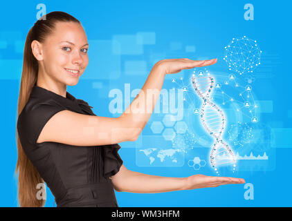 Beautiful businesswoman in dress smiling and holding model of DNA. Scientific and medical concept Stock Photo